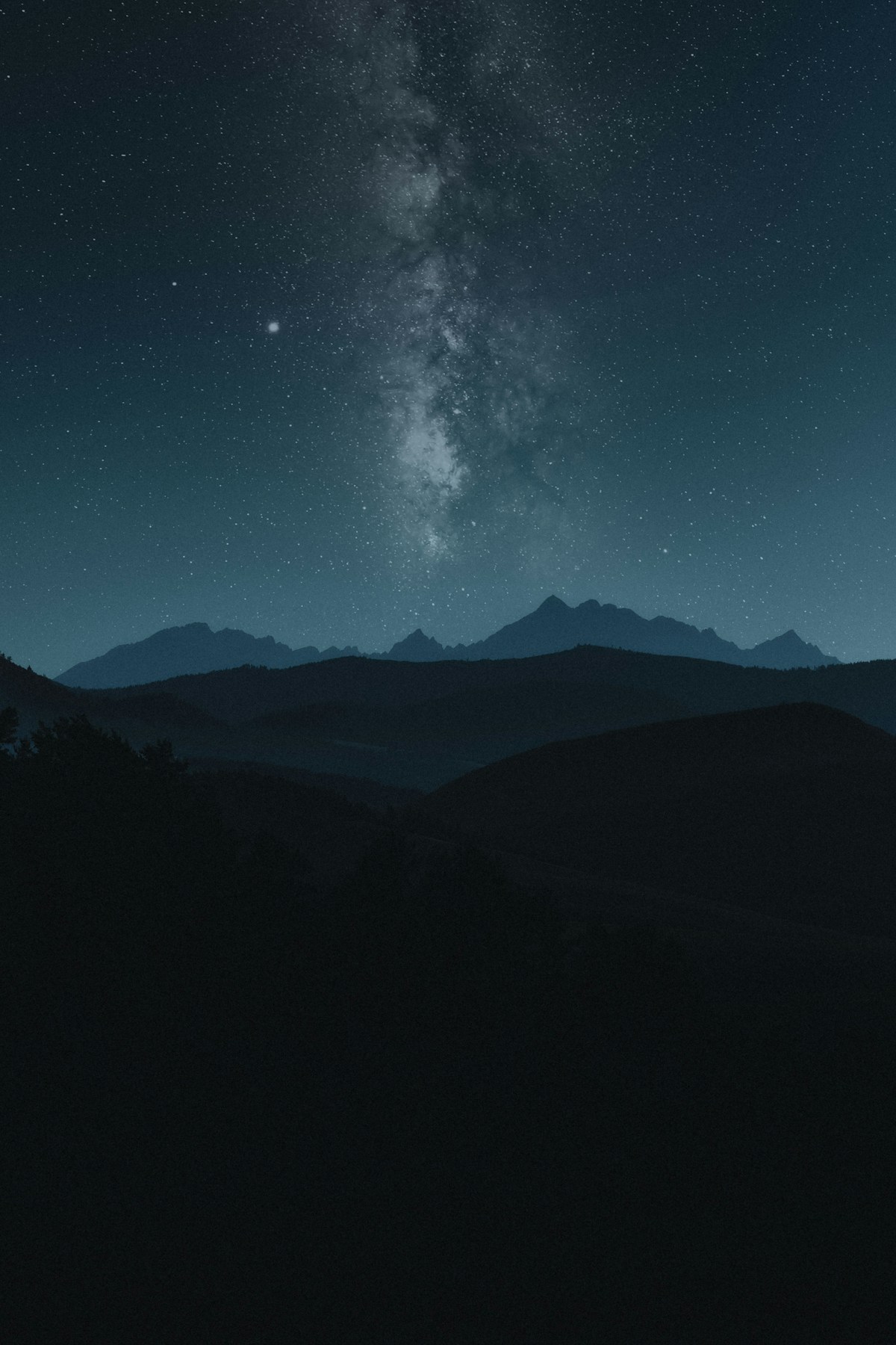 Milky Way rising over a mountain ridgeline in full dark-sky conditions